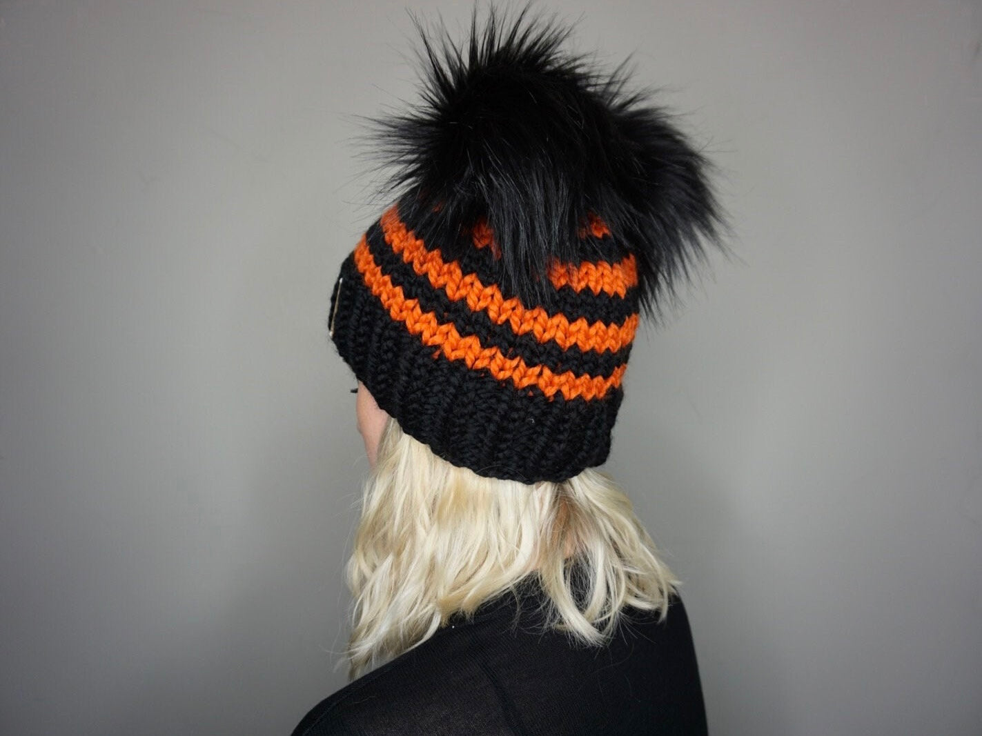 The Halloween Stripe Double Pom Beanie in Orange and Black