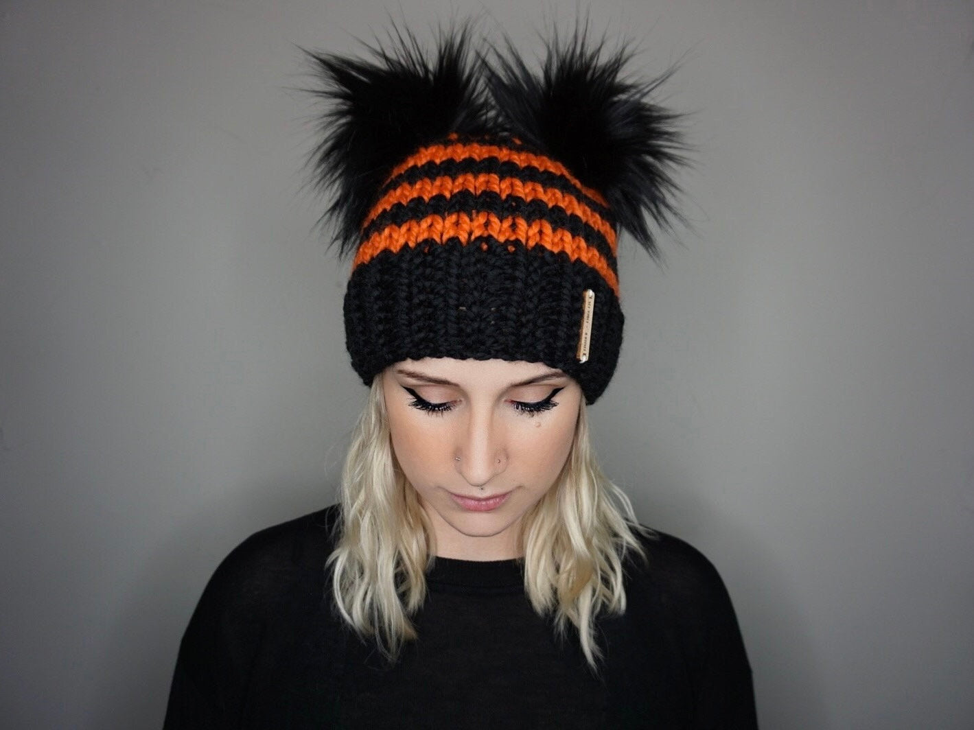 The Halloween Stripe Double Pom Beanie in Orange and Black